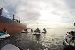 Seadoo by container ships on Vancouver guided