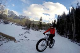 Fat Bike Frozen Waterfall Guided Tour in Kananaskis, at the base of the Rocky Mountains.